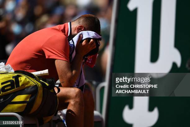 France's Benoit Paire reacts at the end of his men's singles first round tennis match against Norway's Casper Ruud on Day 2 of The Roland Garros 2021...