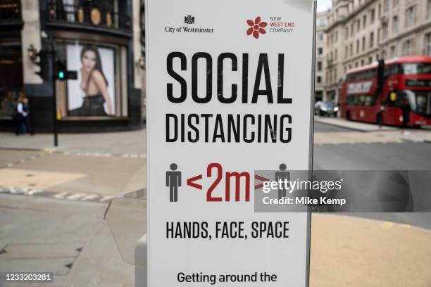 Social distancing sign on Regent Street 'Hands, face, space' on 26th May 2021 in London, United Kingdom. As the coronavirus lockdown continues it's...