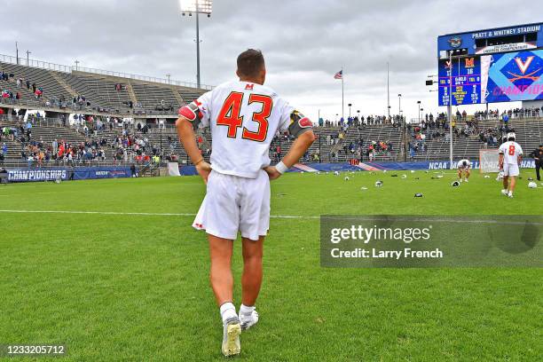 Maryland Terrapins defenseman Brett Makar walks off the field as the Virginia Cavaliers celebrate their win in the Division I Mens Lacrosse...