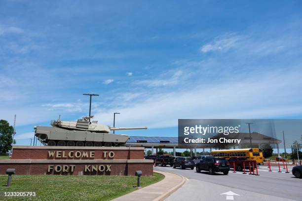An M1 Abrams tank sits on a pedestal above the entrance signage to Fort Knox, a US military installation, on May 31, 2021 in Fort Knox, Kentucky....