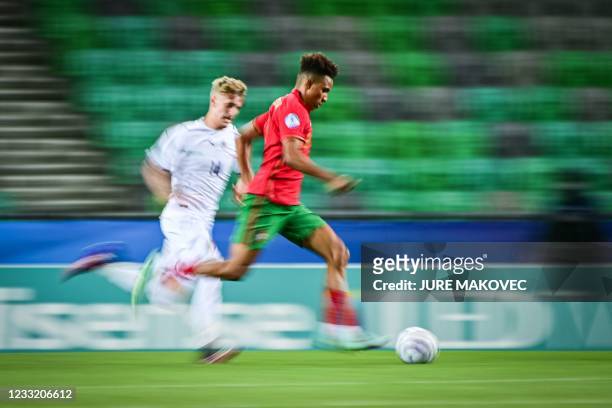 Portugal's Gedson Fernandes controls the ball as Italy's Nicolo Rovella chases him during the 2021 UEFA European Under-21 Championship quarter-final...