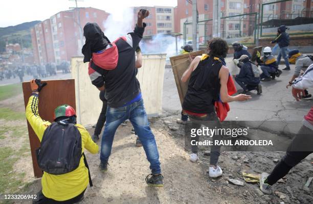 Demonstrators clash with riot police during a protest against the government of Colombian President Ivan Duque, in Facatativa, Colombia, on May 31,...
