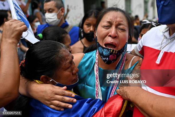 Relatives and friends mourn during the funeral of indigenous leader Sebastian Jacanamijoy, who was killed on May 28, 2021 during a protest against...