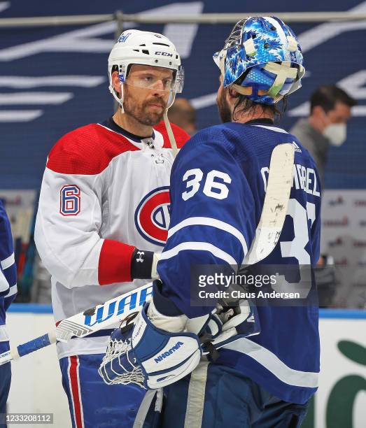 Shea Weber of the Montreal Canadiens shakes hands with Jack Campbell of the Toronto Maple Leafs after Game Seven of the First Round of the 2021...