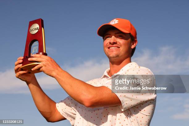 Turk Pettit of the Clemson Tigers celebrates after winning the individual title during the Division I Mens Golf Championship held at the Grayhawk...