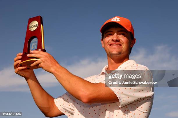 Turk Pettit of the Clemson Tigers celebrates after winning the individual title during the Division I Mens Golf Championship held at the Grayhawk...