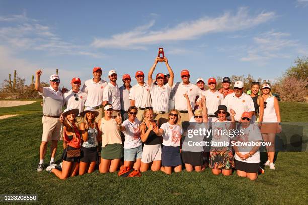 Turk Pettit of the Clemson Tigers along with his teammates and family celebrate after winning the individual title during the Division I Mens Golf...