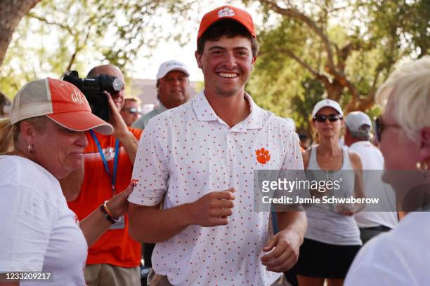 Turk Pettit of the Clemson Tigers celebrates after winning the individual title during the Division I Mens Golf Championship held at the Grayhawk...