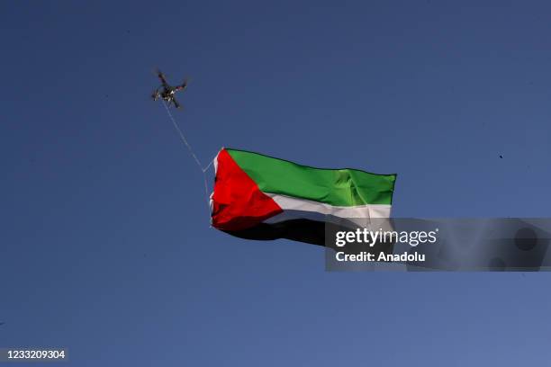 Photo shows a drone carrying Palestinian flag as hundreds gather at the Little Yemen district of Bronx and take streets to protest Israeli aggression...