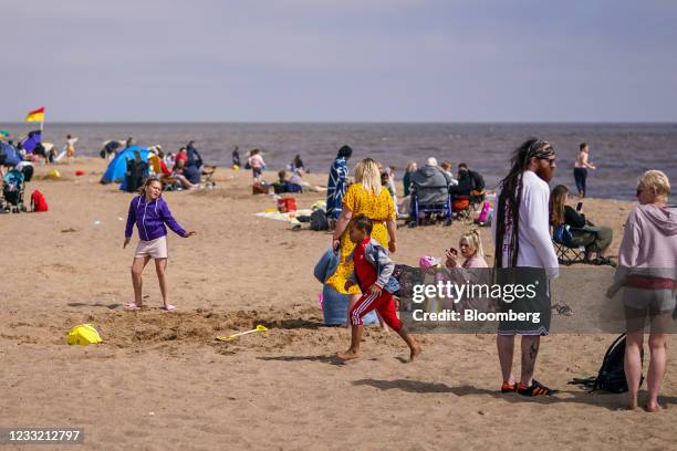 Beachgoers relax on the beach in Skegness, U.K., on Monday, May 31, 2021. U.K. Health Secretary Matt Hancock said people who want to go on holiday...