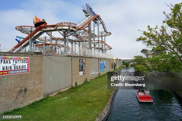 Family ride a hire boat along a waterway next to a theme park in Skegness, U.K., on Monday, May 31, 2021. U.K. Health Secretary Matt Hancock said...