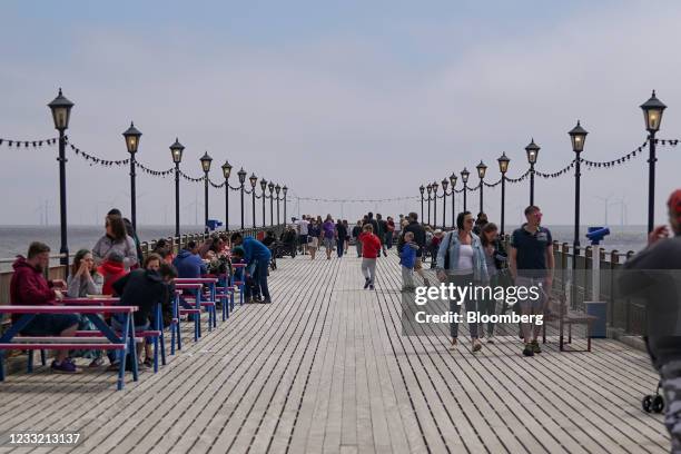 Visitors on the pier in Skegness, U.K., on Monday, May 31, 2021. U.K. Health Secretary Matt Hancock said people who want to go on holiday should stay...