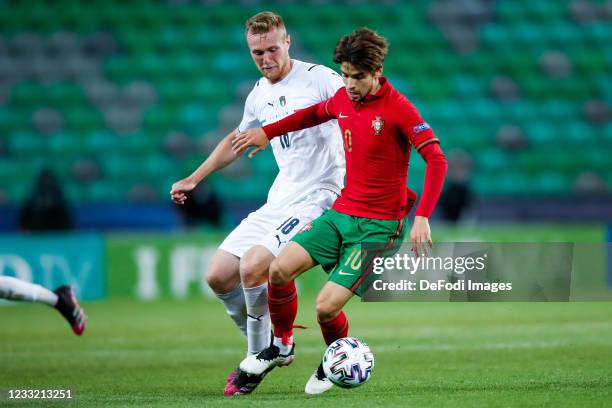 Tommaso Pobega of Italy and Daniel Braganca of Portugal battle for the ball during the 2021 UEFA European Under-21 Championship Quarter-finals match...