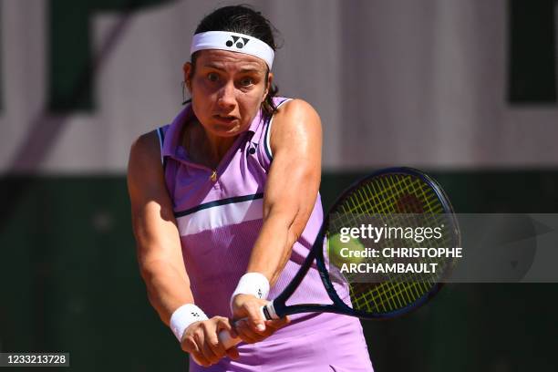 Latvia's Anastasija Sevastova returns the ball to Jennifer Brady of the US during their women's singles first round tennis match on Day 3 of The...