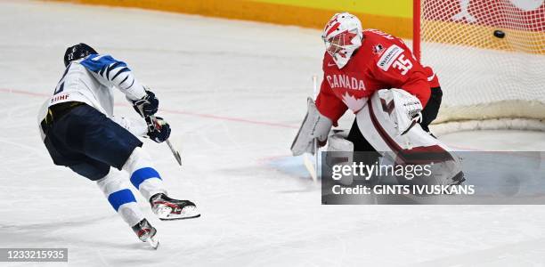 Finland's forward Arttu Ruotsalainen scores a goal past Canada's goalkeeper Darcy Kuemper during a shootout of the IIHF Men's Ice Hockey World...