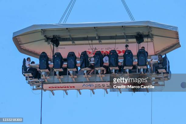 View of "Dinner in the Sky", a suspended platform 50 meters above the ground, in Naples in the Mostra d'Oltremare, on which 22 people eat food...