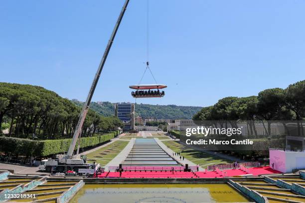 View of "Dinner in the Sky", a suspended platform 50 meters above the ground, in Naples in the Mostra d'Oltremare, on which 22 people eat food...