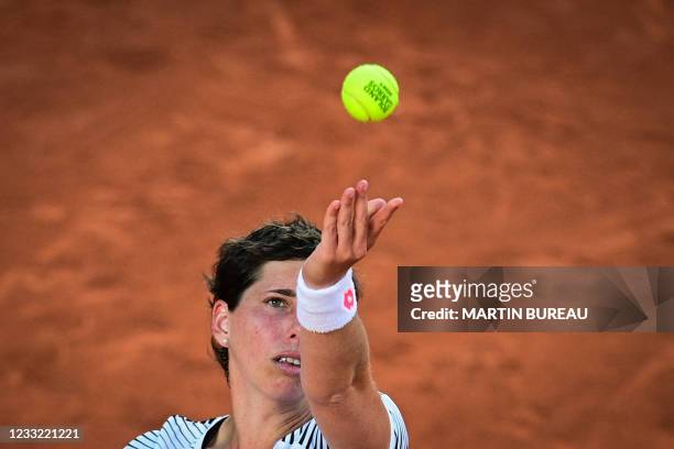 Spain's Carla Suarez Navarro serves the ball to Sloane Stephens of the US during their women's singles first round tennis match on Day 3 of The...
