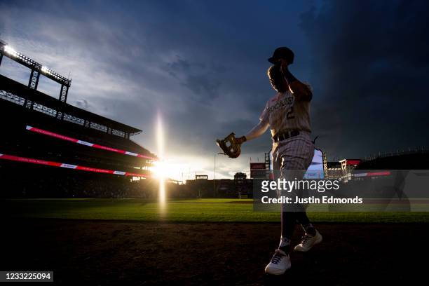 Yonathan Daza of the Colorado Rockies walks to the dugout after the top of the fourth inning against the Texas Rangers at Coors Field on June 1, 2021...