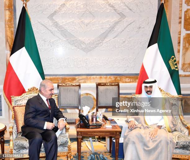 Kuwaiti Emir Sheikh Nawaf Al-Ahmad Al-Jaber Al-Sabah R meets with Palestinian Prime Minister Mohammed Ishtaye, in Kuwait City, Kuwait, June 1, 2021.