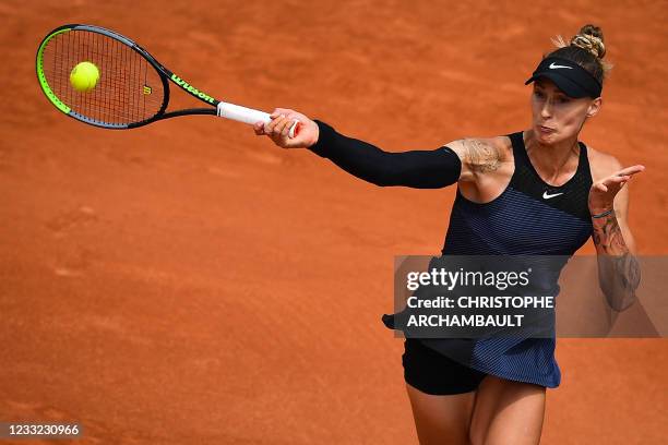 Slovenia's Polona Hercog returns the ball to France's Caroline Garcia during their women's singles second round tennis match on Day 4 of The Roland...