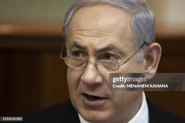 Israeli Prime Minister Benjamin Netanyahu addresses the weekly cabinet meeting in Jerusalem on January 9 one day after the Israeli premier's office...