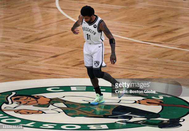Just before tip off, Kyrie Irving of the Brooklyn Nets wiped his sneakers on the Celtics logo at center court. The Boston Celtics hosted the Brooklyn...