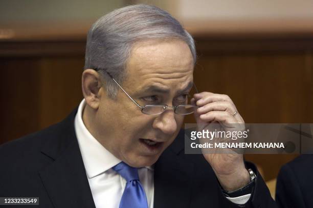 Israeli Prime Minister Benjamin Netanyahu addresses the weekly cabinet meeting in Jerusalem on January 9 one day after the Israeli premier's office...