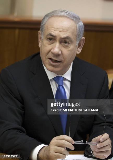 Israeli Prime Minister Benjamin Netanyahu addresses the weekly cabinet meeting in Jerusalem on January 9 one day after the Israeli premier's office...