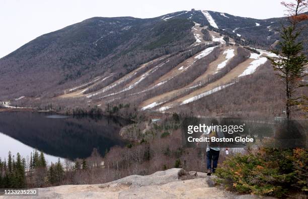 Franconia, NH A hiker made his way along the rocks at Artists Bluff in New Hampshires White Mountains in Franconia, NH on April 28, 2021.