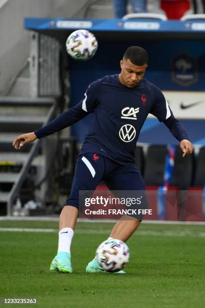 France's forward Kylian Mbappe warms up before the friendly football match between France and Wales at the Allianz Riviera Stadium in Nice, southern...