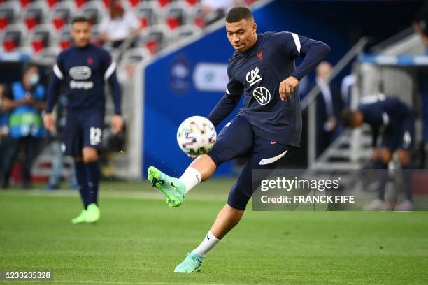 France's forward Kylian Mbappe kicks the ball before the friendly football match between France and Wales at the Allianz Riviera Stadium in Nice,...