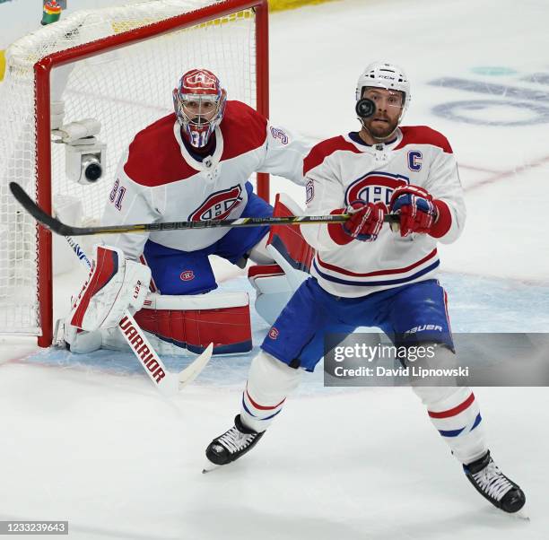 Shea Weber of the Montreal Canadiens keeps his eye on the puck in front of Carey Price as they play the Winnipeg Jets in Game One of the Second Round...