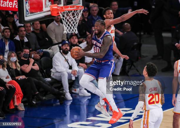 Julius Randle of the the New York Knicks drives to the basket in the third quarter against the Atlanta Hawks during Game Five of the Eastern...