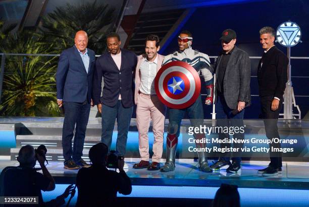 Bob Chapek, Chief Executive Officer of The Walt Disney Company, left, Anthony Mackie, Paul Rudd, a Disney cast member playing Captain America, Kevin...