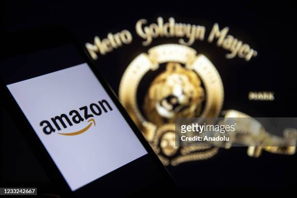 In this illustration photo Amazon logo is displayed on a smart phone screen with Goldwyn Mayer , in Ankara, Turkey on June 3, 2021.