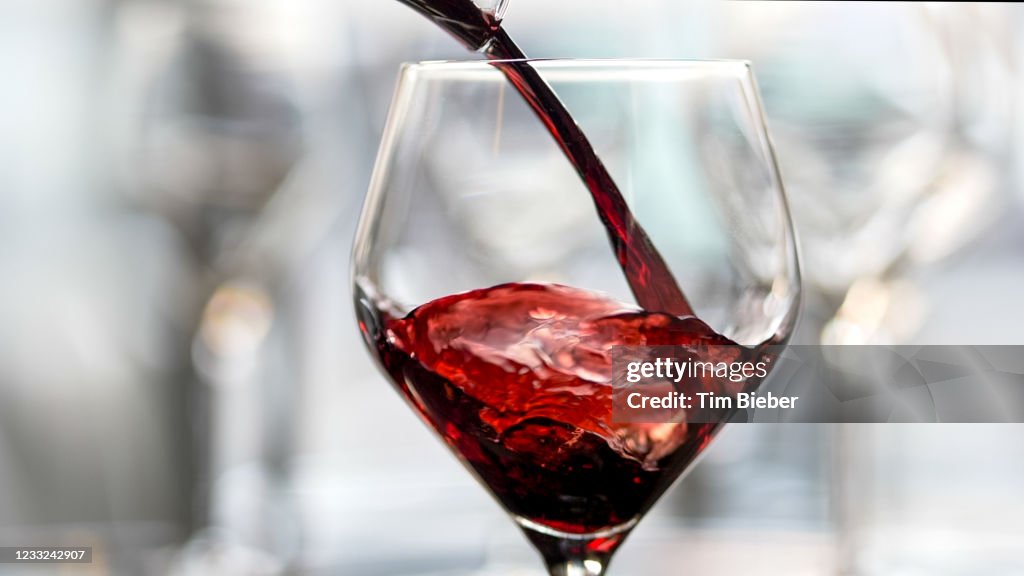 Wine being poured into a glass