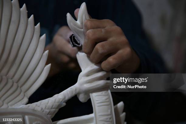 Craftsmen make a statue of Garuda Pancasila as the symbol of the state in a home industry in the Greater Bali area, Kalimalang, East Jakarta, On JUNE...
