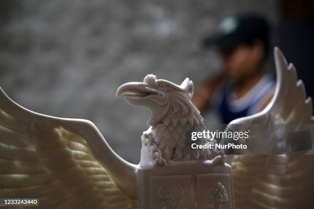 Craftsmen make a statue of Garuda Pancasila as the symbol of the state in a home industry in the Greater Bali area, Kalimalang, East Jakarta, On JUNE...