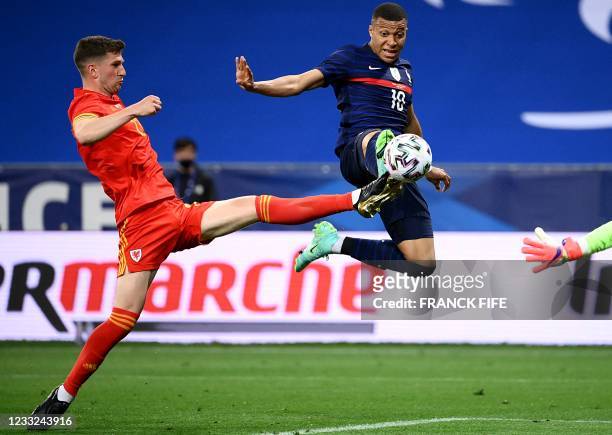 France's forward Kylian Mbappe scores a goal during the friendly football match between France and Wales at the Allianz Riviera Stadium in Nice,...