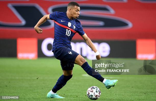 France's forward Kylian Mbappe dribbles during the friendly football match between France and Wales at the Allianz Riviera Stadium in Nice, southern...