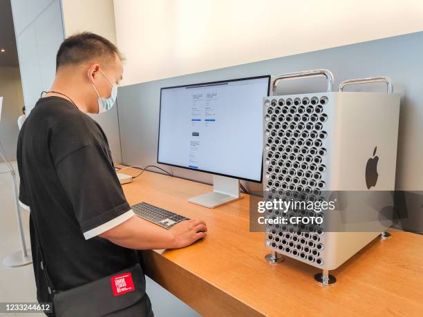 Customer looks at a Mac Pro workstation at Apple's flagship store on Nanjing Road in Shanghai, China, June 2, 2021.
