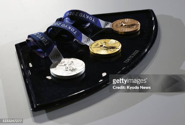 Photo taken in Tokyo on June 3 shows a tray to be used for medal ceremonies at the Tokyo Olympics and Paralympics, unveiled to the media 50 days...