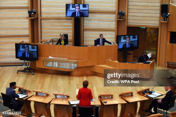 Scottish First Minister Nicola Sturgeon responds to a question from leader of the opposition Scottish Conservatives, Douglas Ross, who is in Covid-19...