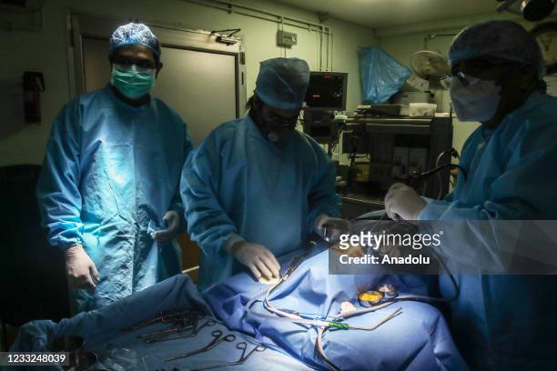 Specialist Dr. Brajpal Singh Tyagi performs a surgery to remove black fungus from a patient Adesh , who recovered from the coronavirus at a hospital...