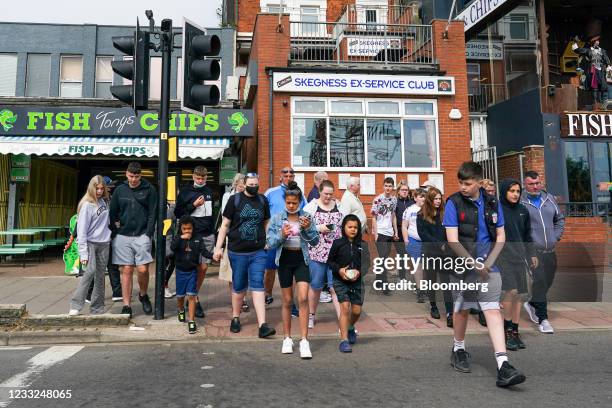 Pedestrians cross the main promenade in Skegness, U.K., on Monday, May 31, 2021 .U.K. Health SecretaryMatt Hancocksaid people who want to go...