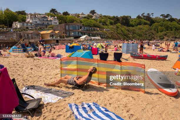 Beach-goers in front of the Carbis Bay Hotel and Resort, the venue for the upcoming Group of Seven leaders summit, in Carbis Bay, U.K., on Thursday,...