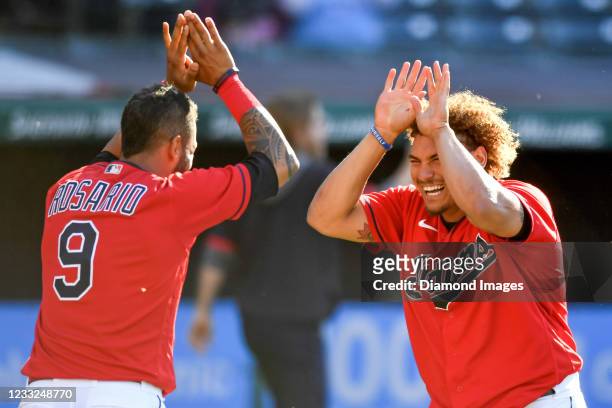 Josh Naylor and Eddie Rosario of the Cleveland Indians celebrate a game winning sacrifice fly by Jose Ramirez in the seventh inning of game two of a...