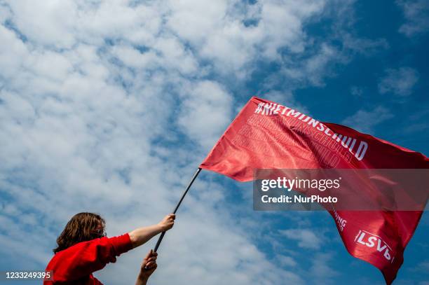 Student is holding a big red flag that says it's not my fault, the slogan of the student protest, during the Nationwide student strike, organized in...