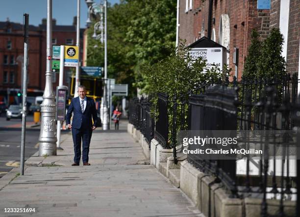 Democratic Unionist party leader Edwin Poots pauses as he walks along Merrion Square outside Government Buildings before meeting with Taoiseach...